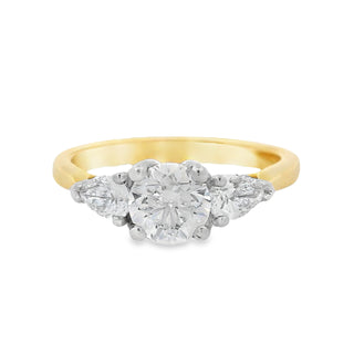 0.70ct F SI1 Brilliant Cut Solitaire with Pear Cut Sides Three Stone Diamond Ring in 18ct Yellow Gold