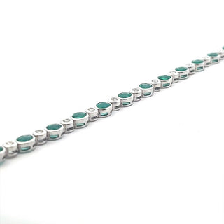 Emerald Oval Cut and Brilliant Cut Diamond Bezel Set Bracelet in 18ct White Gold